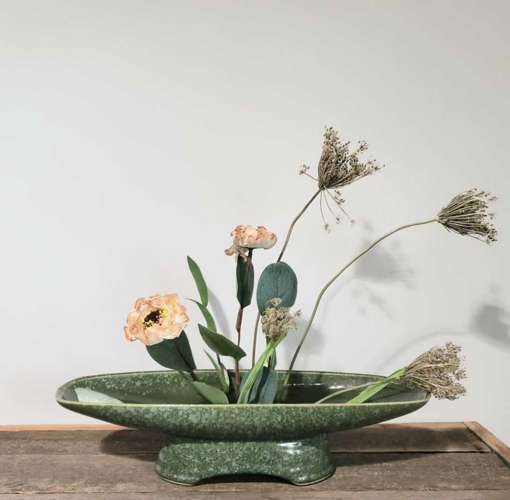 Vintage oblong vase with dried flowers