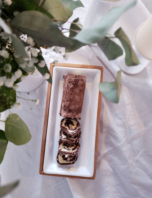 Chocolate roll on a platter. Unelmatorttu dream roll on a platter.