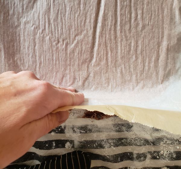 Peeling parchment paper off a cake. Peeling parchment paper off a cake.