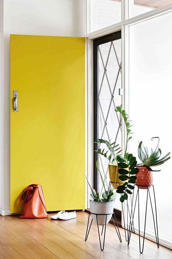 Bright yellow door that is open.