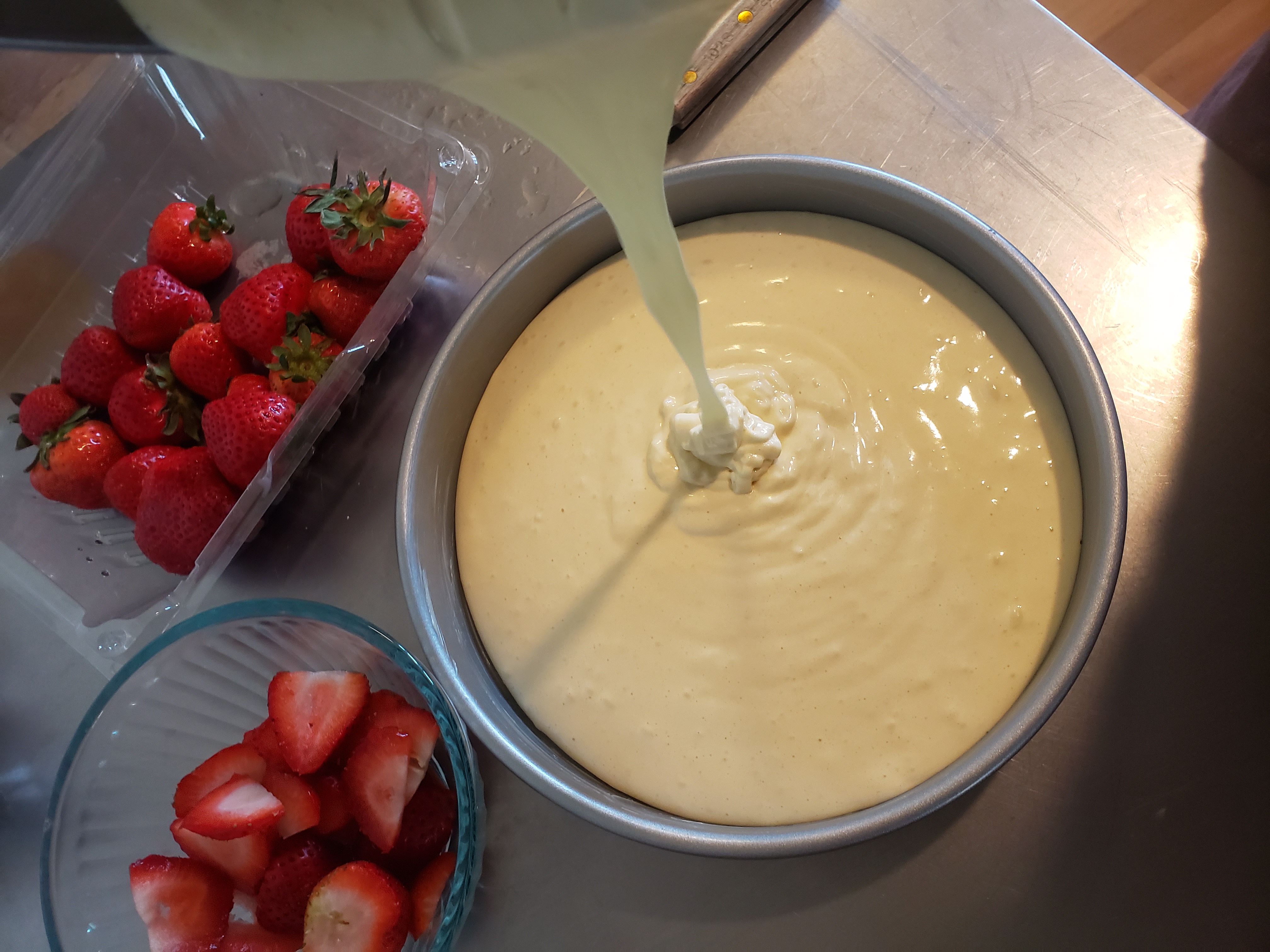 Pouring cake batter into a prepared pan