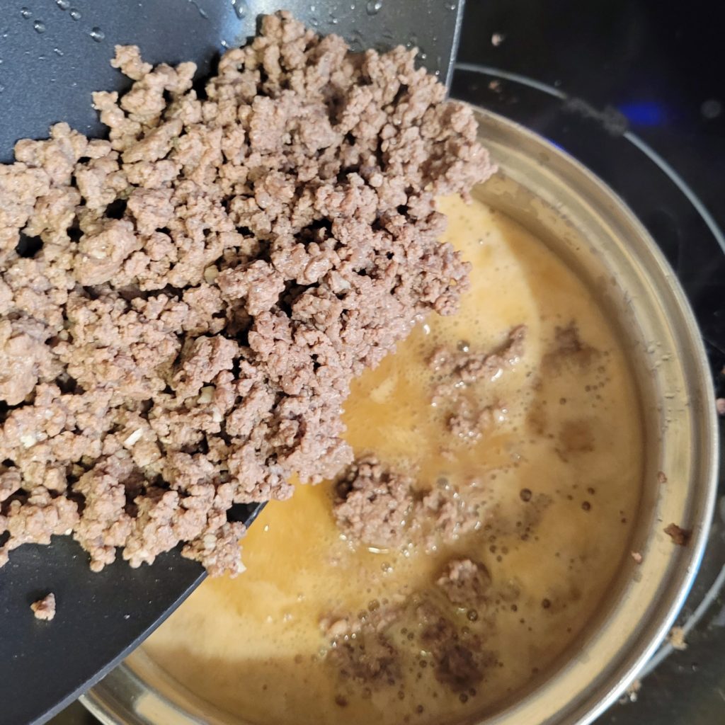 adding ground beef to the gravy