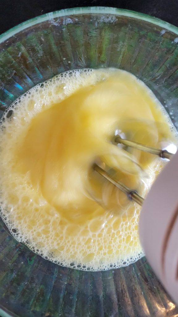 Beating eggs Eggs being beaten in a glass bowl.